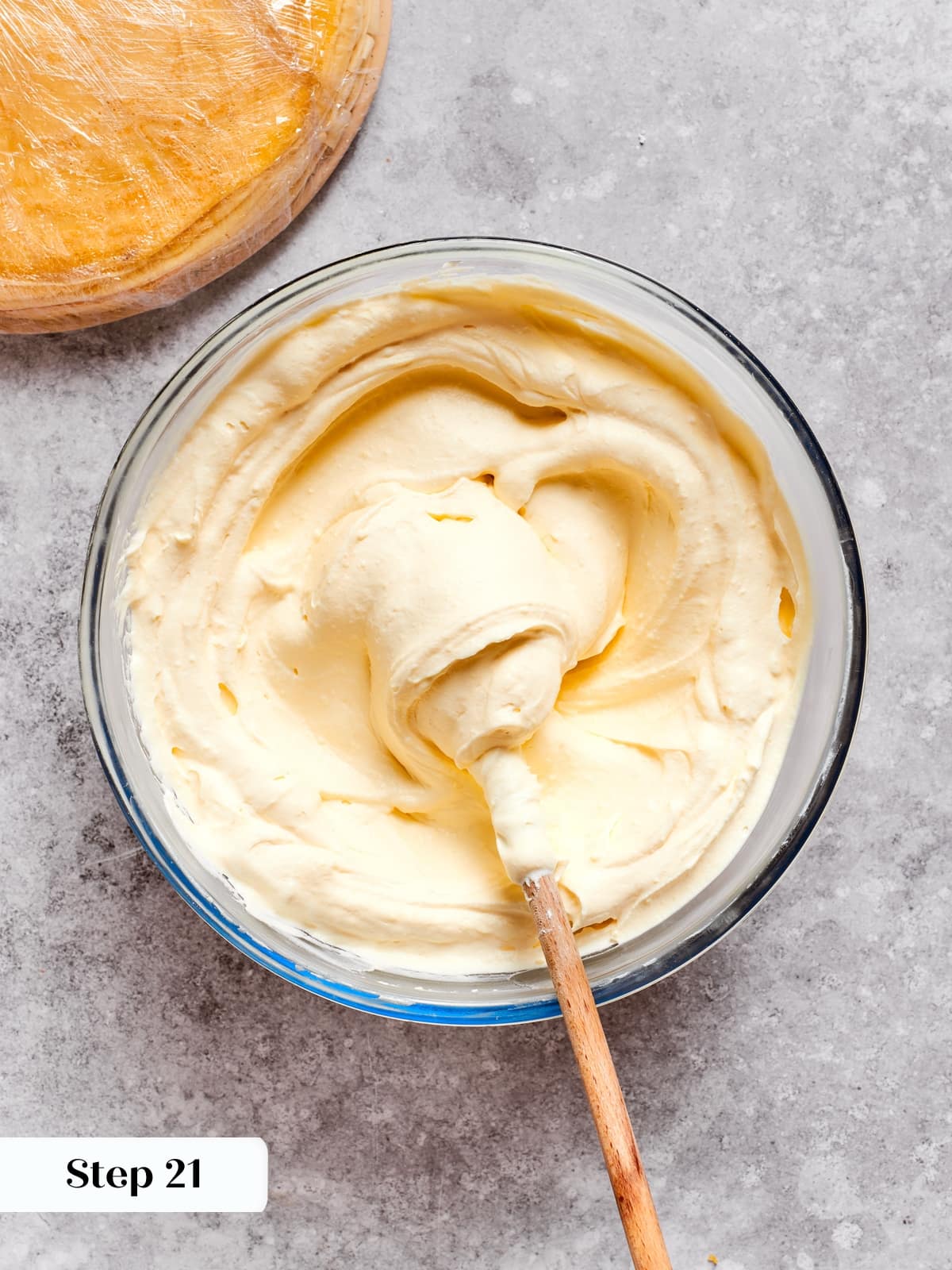 Gentle mixing of whipped cream into the smooth pastry cream to create the final filling.