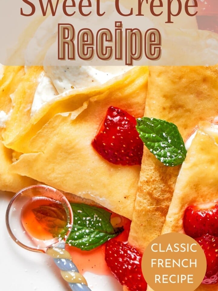 Fresh sweet crepes folded into quarters beside sliced fruit and powdered sugar.
