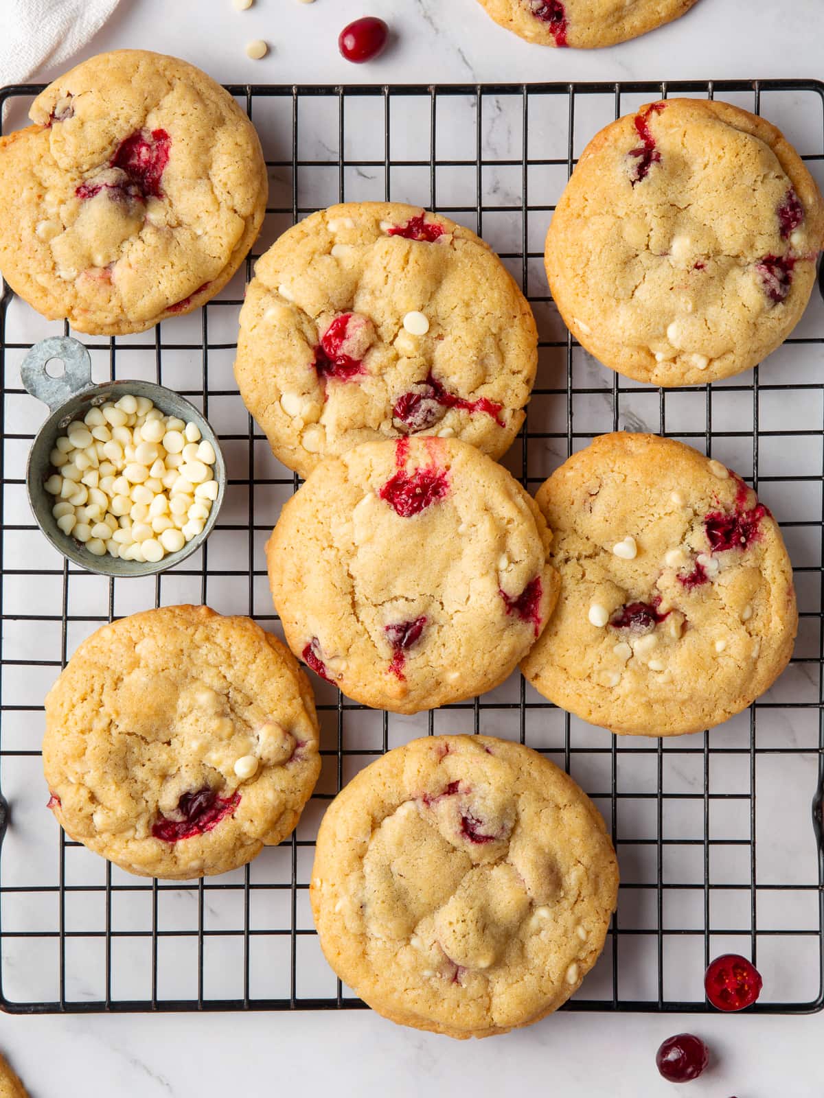 Golden cookies cooling completely to set their chewy texture and sweet-tart flavor.