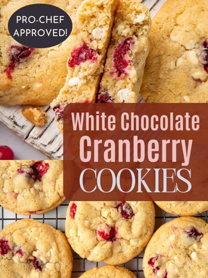 Cooling rack of chewy cranberry cookies surrounded by scattered cranberries and bits of white chocolate.