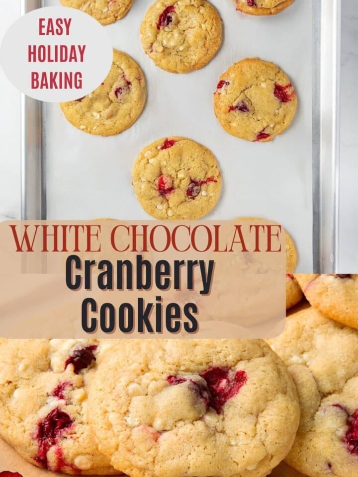 Freshly baked cranberry cookies filled with melted white chocolate chips and bright red cranberries cooling on a baking sheet.