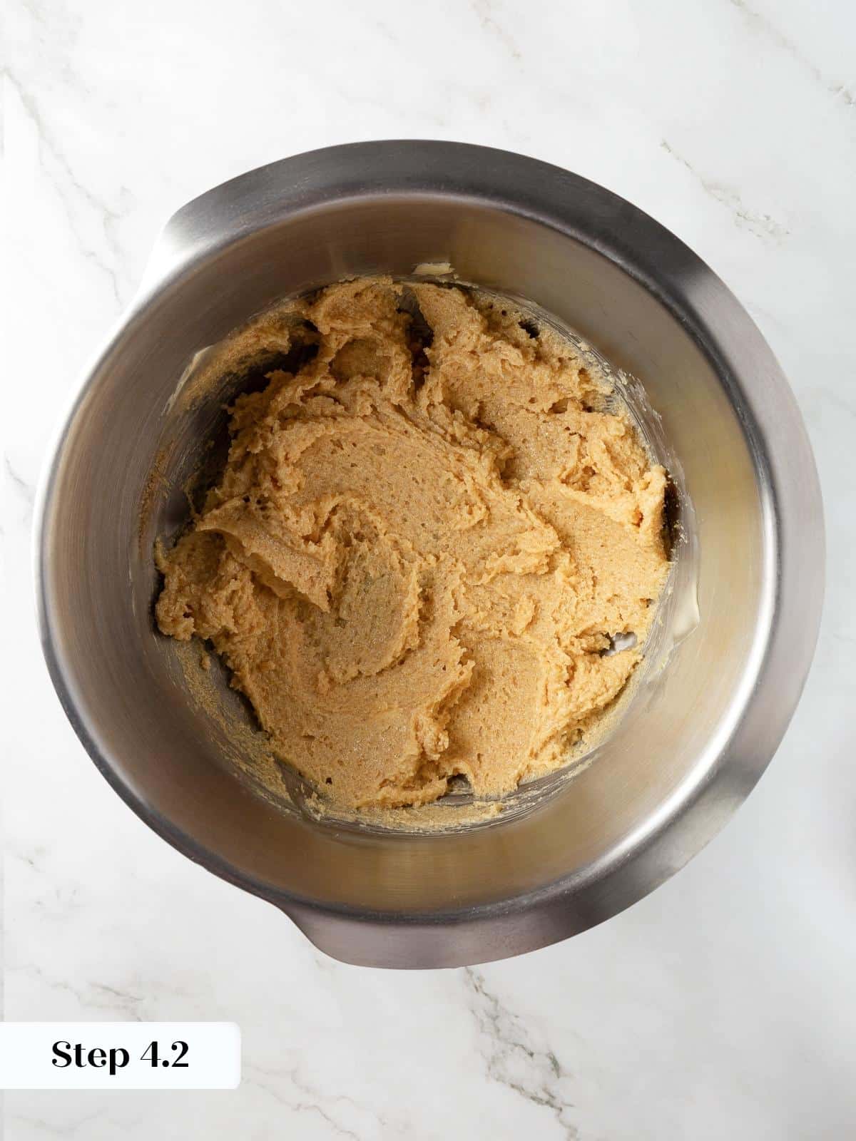 Creamed butter and sugar mixture ready for eggs and dry ingredients in the cookie recipe.
