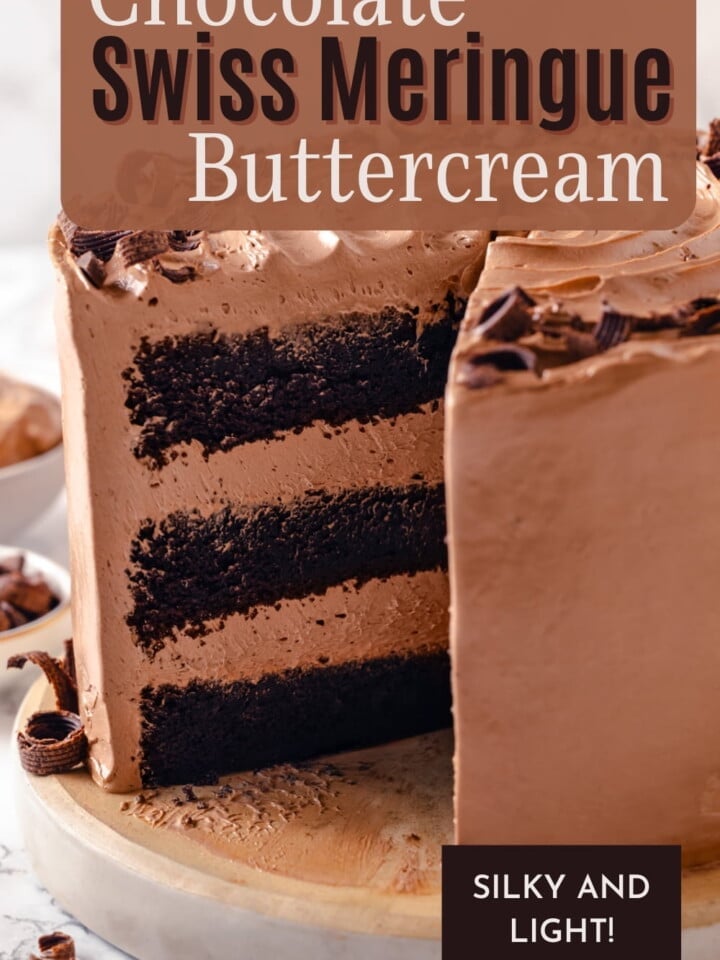 Chocolate Swiss meringue buttercream piled high on a cake, showing its smooth texture and rich color.