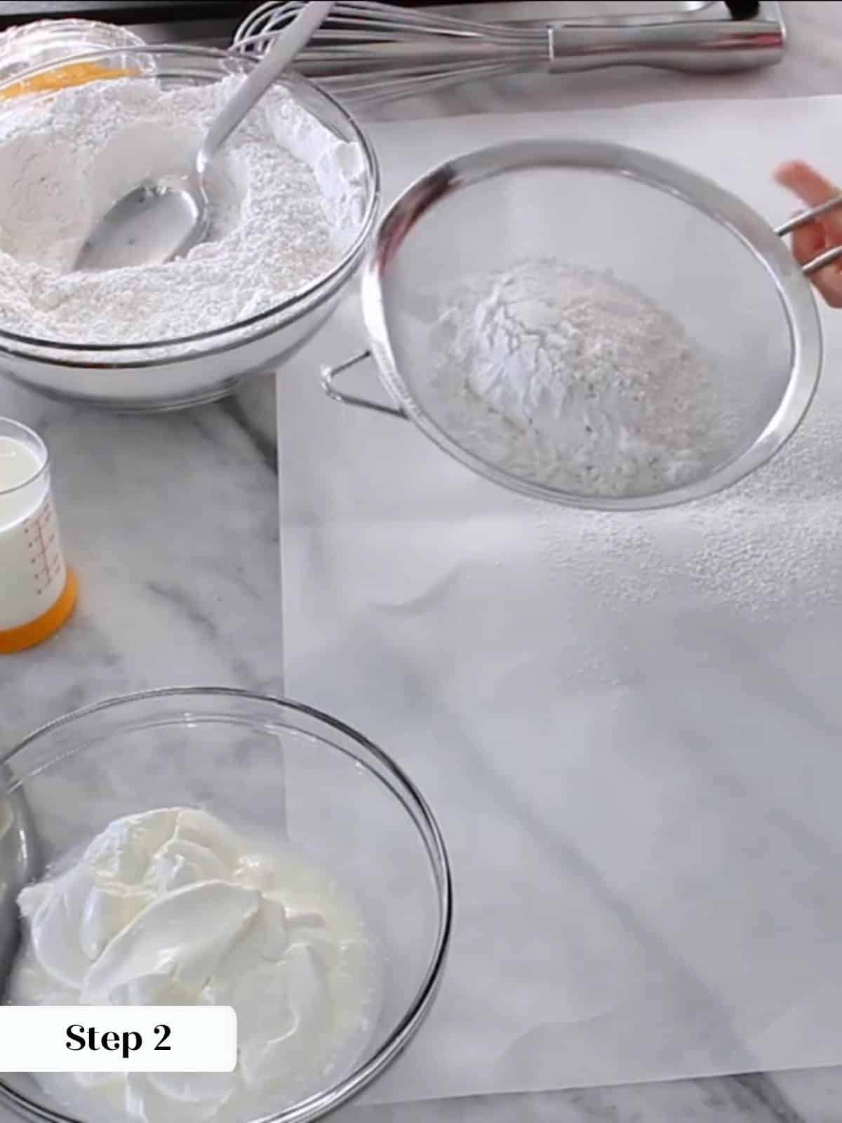 Cake flour, cornstarch, baking powder, and salt being sifted together for yellow cake.