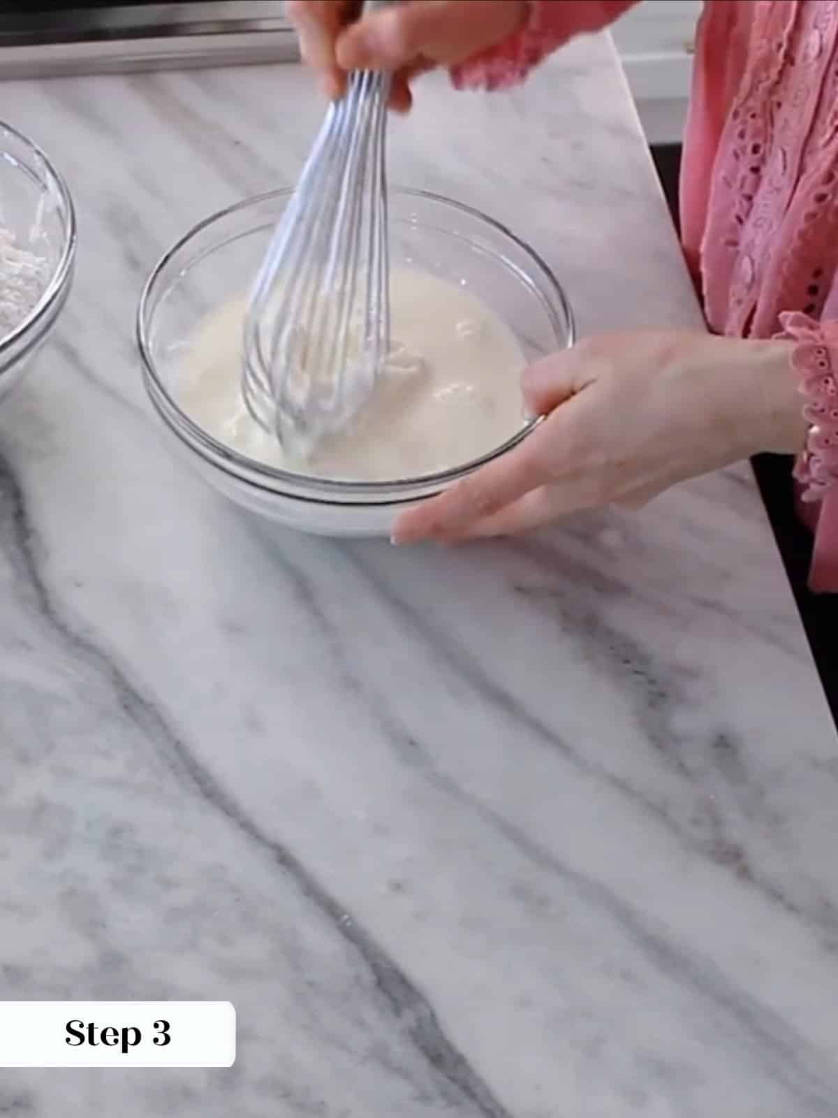 Milk and sour cream whisked together smoothly before adding to yellow cake batter.