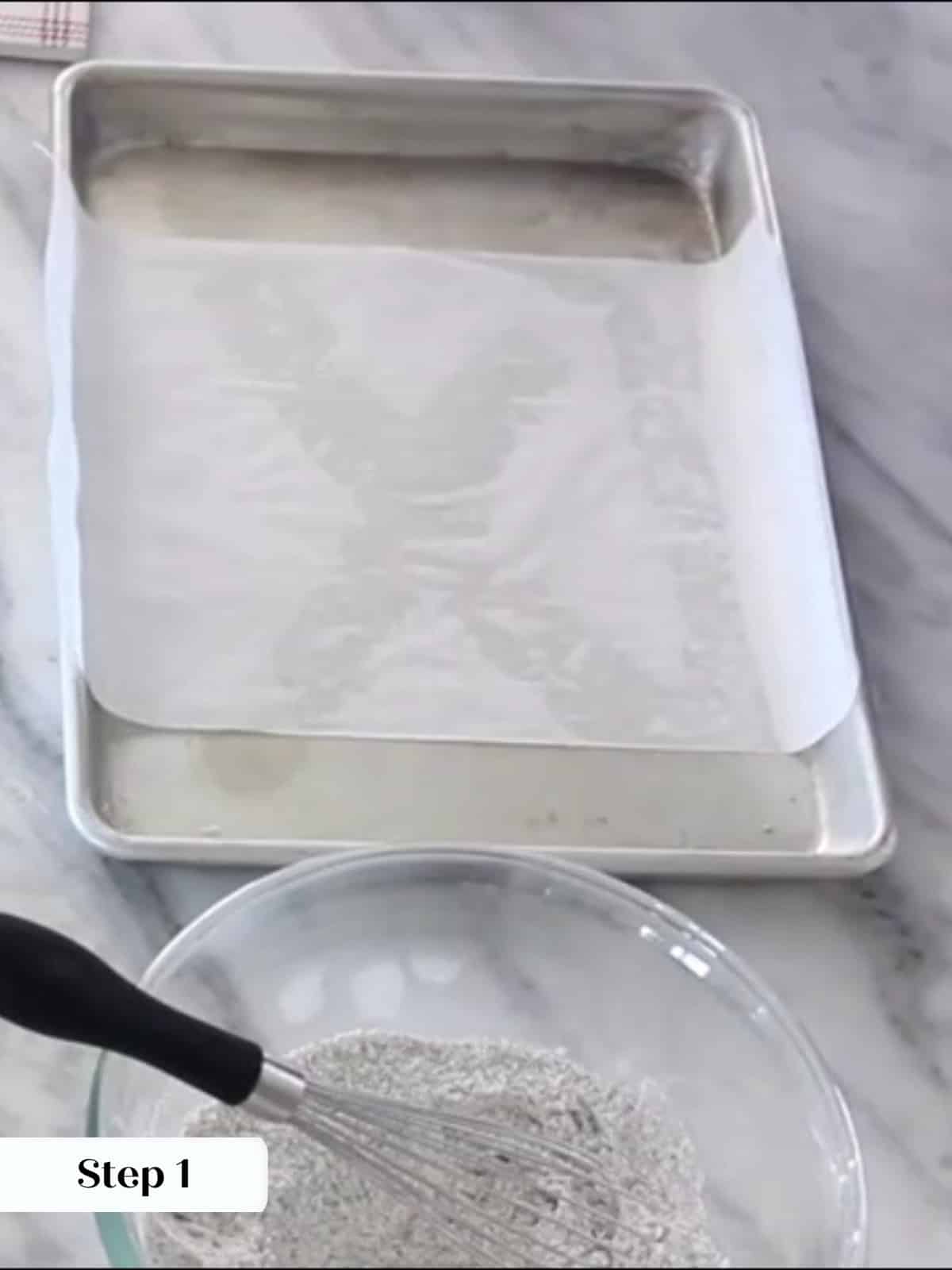 Prepared baking pan with parchment overhangs designed to lift brownies cleanly after cooling.