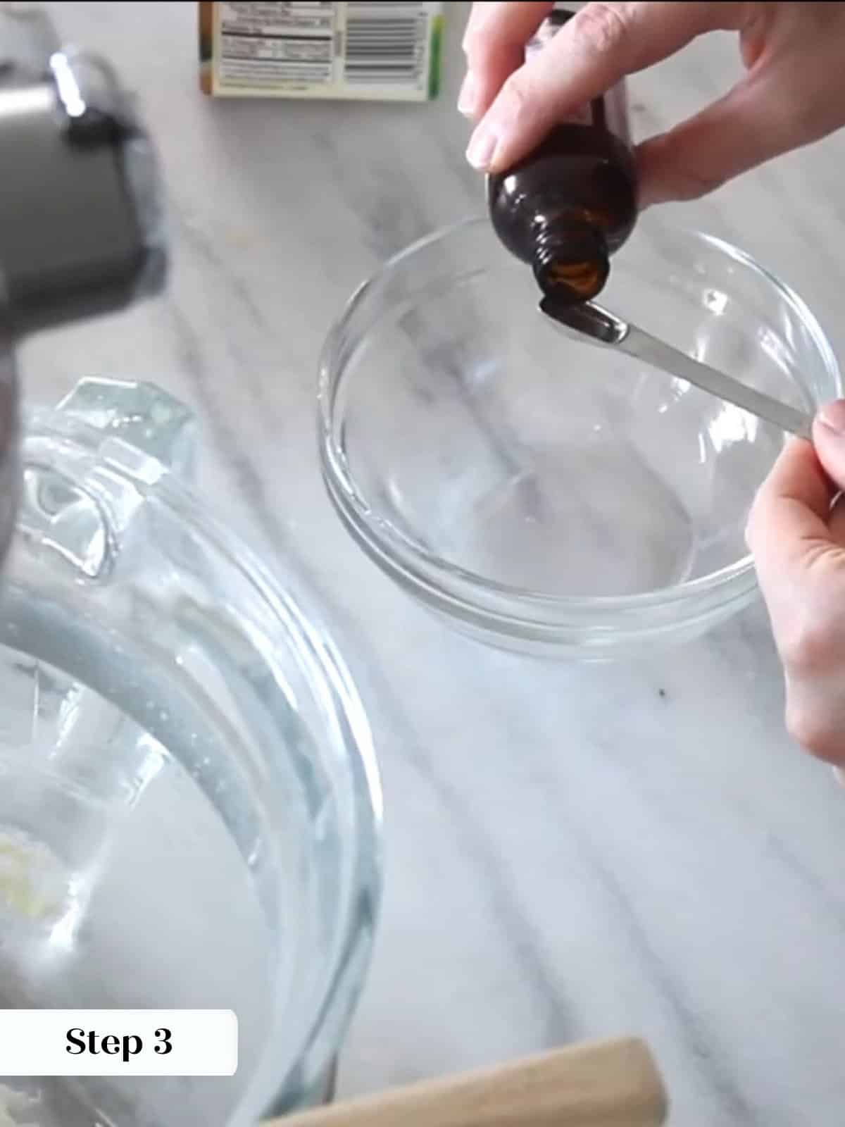 Peppermint extract being added to buttercream mixture, gently flavoring frosting during mixing.