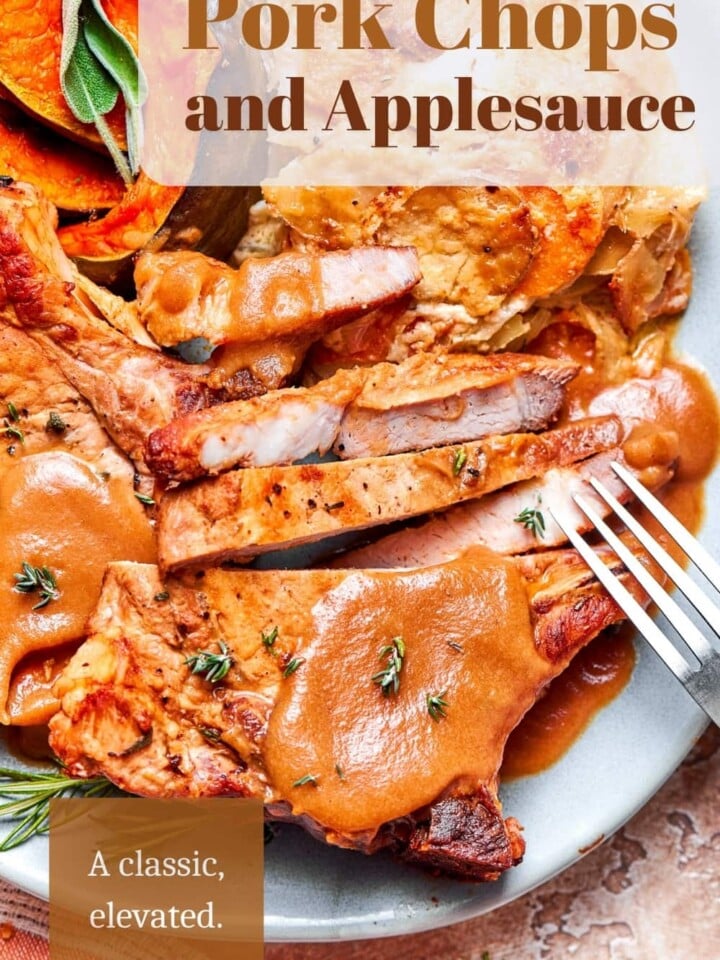 Juicy pork chops finished with apple cider applesauce sauce ready for a cozy dinner.