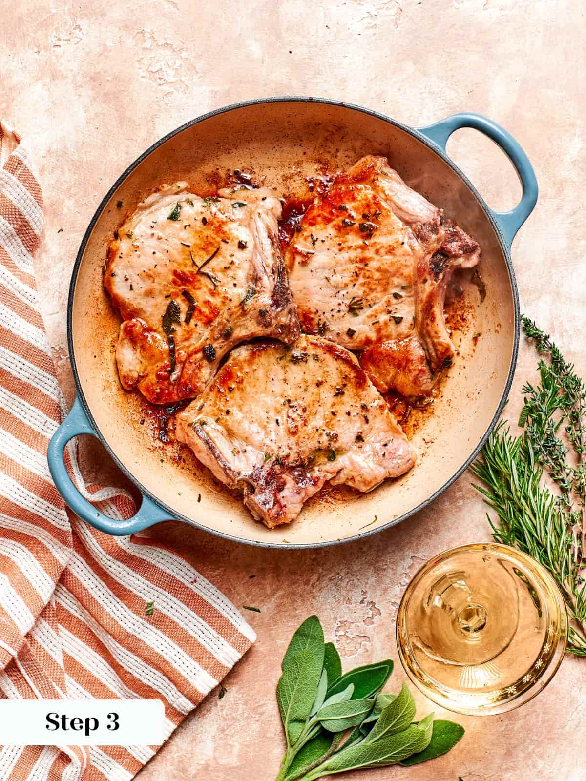 Pan-seared pork chops cooked through and ready to be sauced.