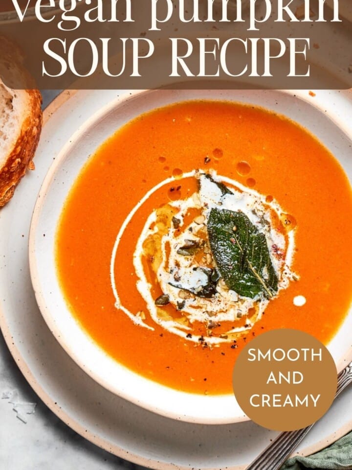 Vegan pumpkin soup with a rich orange color served in a bowl for a fall meal.