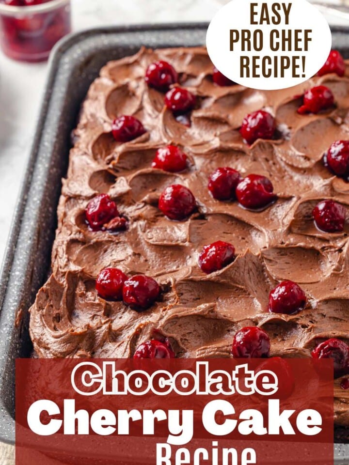 Chocolate cherry sheet cake with fluffy chocolate buttercream frosting and cherries on top.