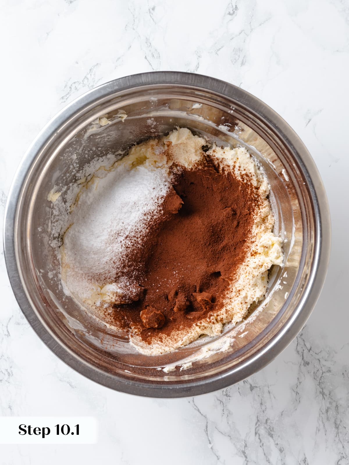 Cocoa powder and powdered sugar added to buttercream for chocolate frosting.