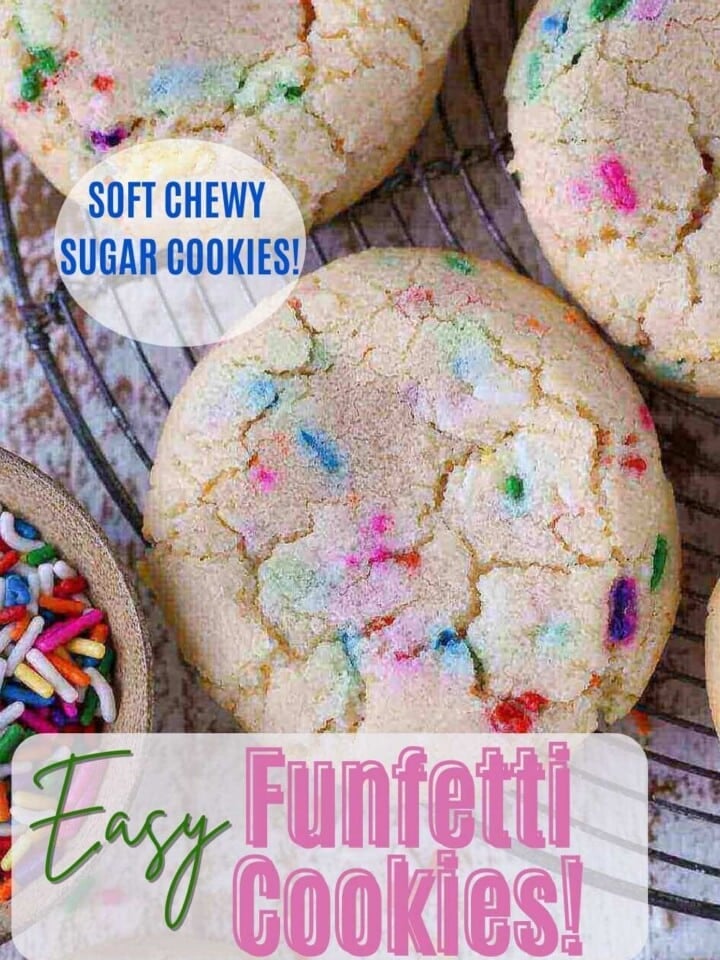 Round colorful funfetti sugar cookies arranged on a cooling rack.