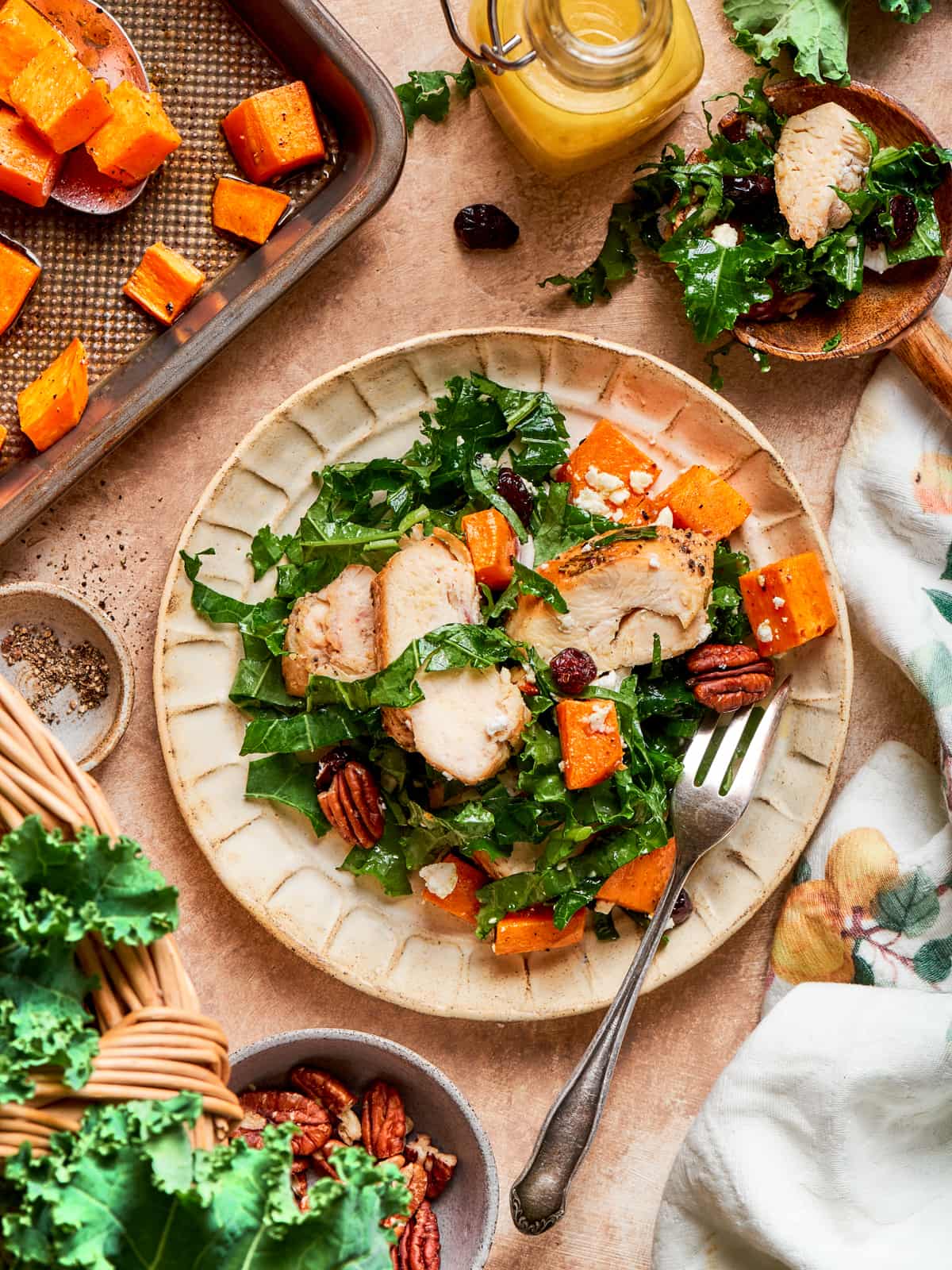 Plated kale sweet potato salad with fork resting beside the dish.