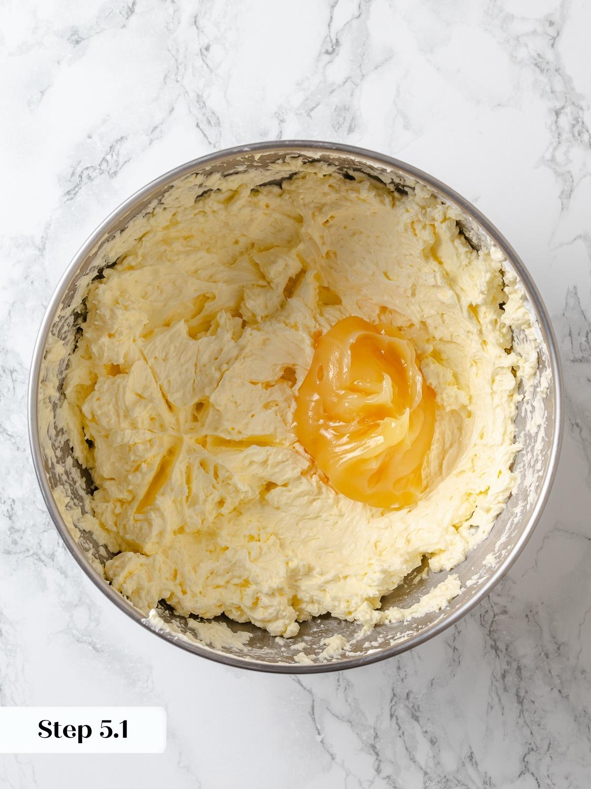 Adding lemon curd to buttercream for bold flavor without breaking texture.
