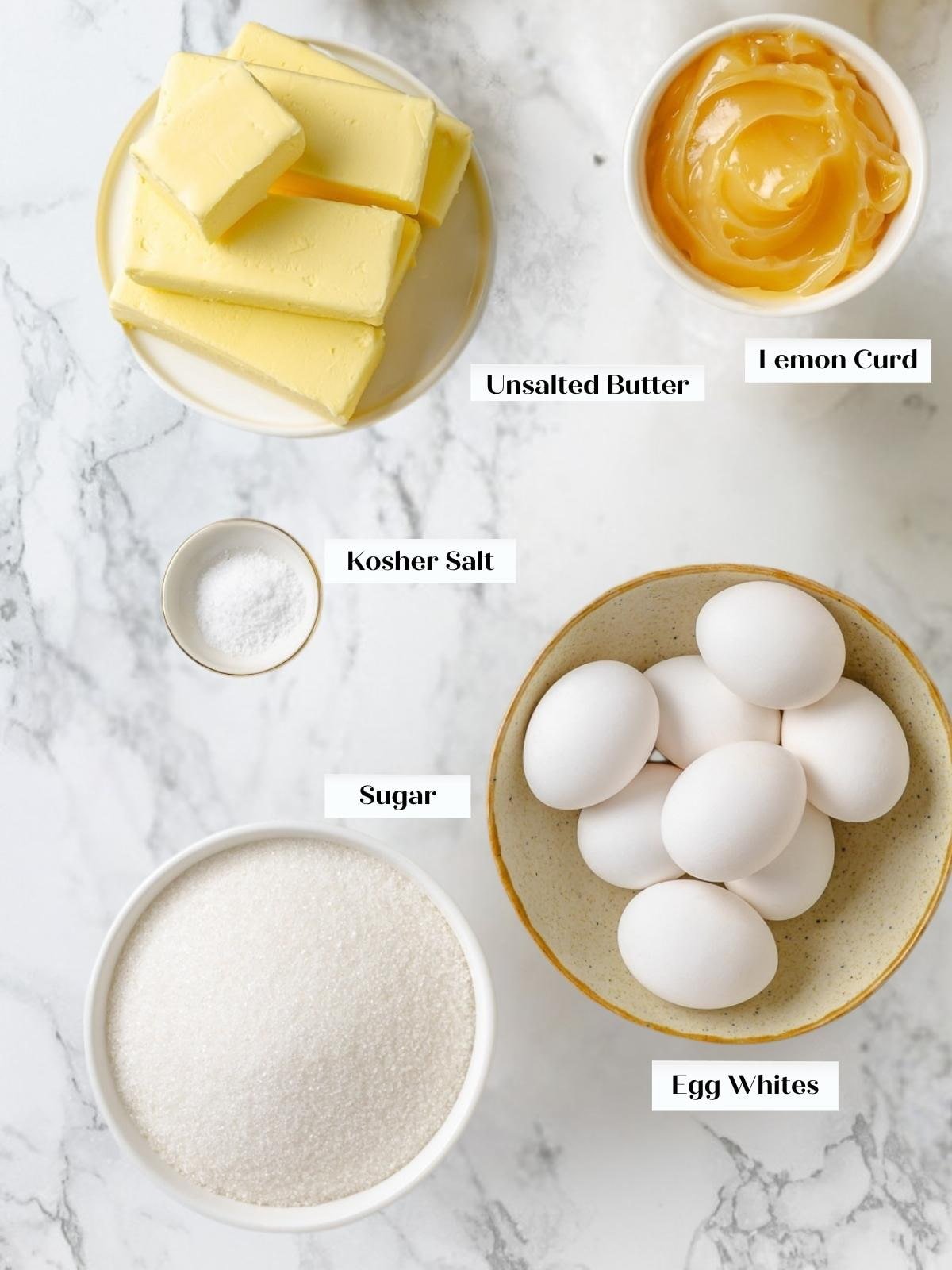 Butter, egg whites, sugar, salt, and lemon curd prepared for Swiss meringue buttercream.