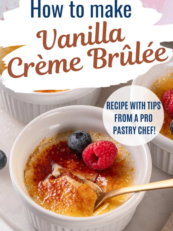 Vanilla crème brûlée with a cracked caramelized sugar top garnished with a raspberry and blueberries. Text overlay reads Recipe with tips from a pro pastry chef.