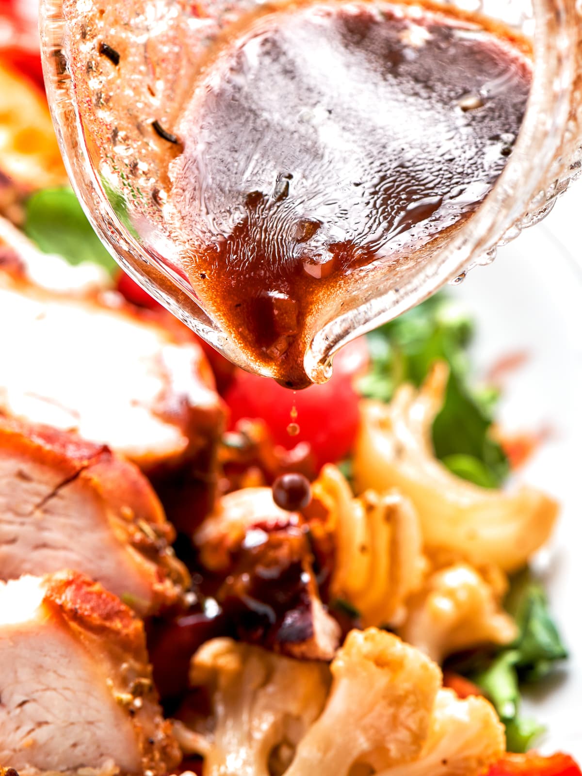 Lemon balsamic vinaigrette poured over mixed greens and chicken.