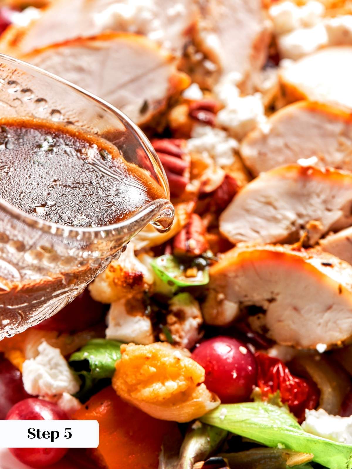 Light lemon balsamic vinaigrette poured over assembled salad ingredients.