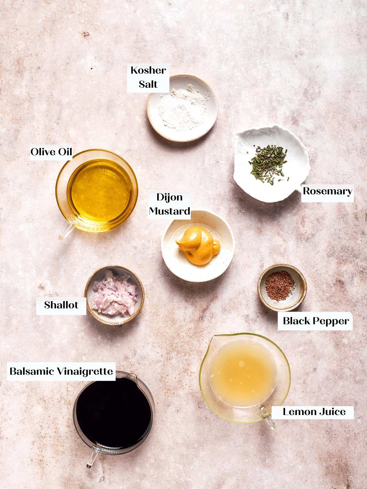 Ingredients for lemon balsamic vinaigrette arranged on countertop.