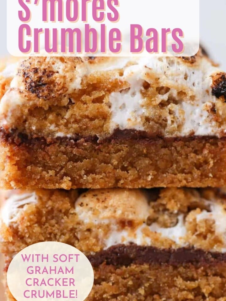 S'mores crumble bars with melty toasted marshmallows on top. Text overlay reads with marshmallow fluff.