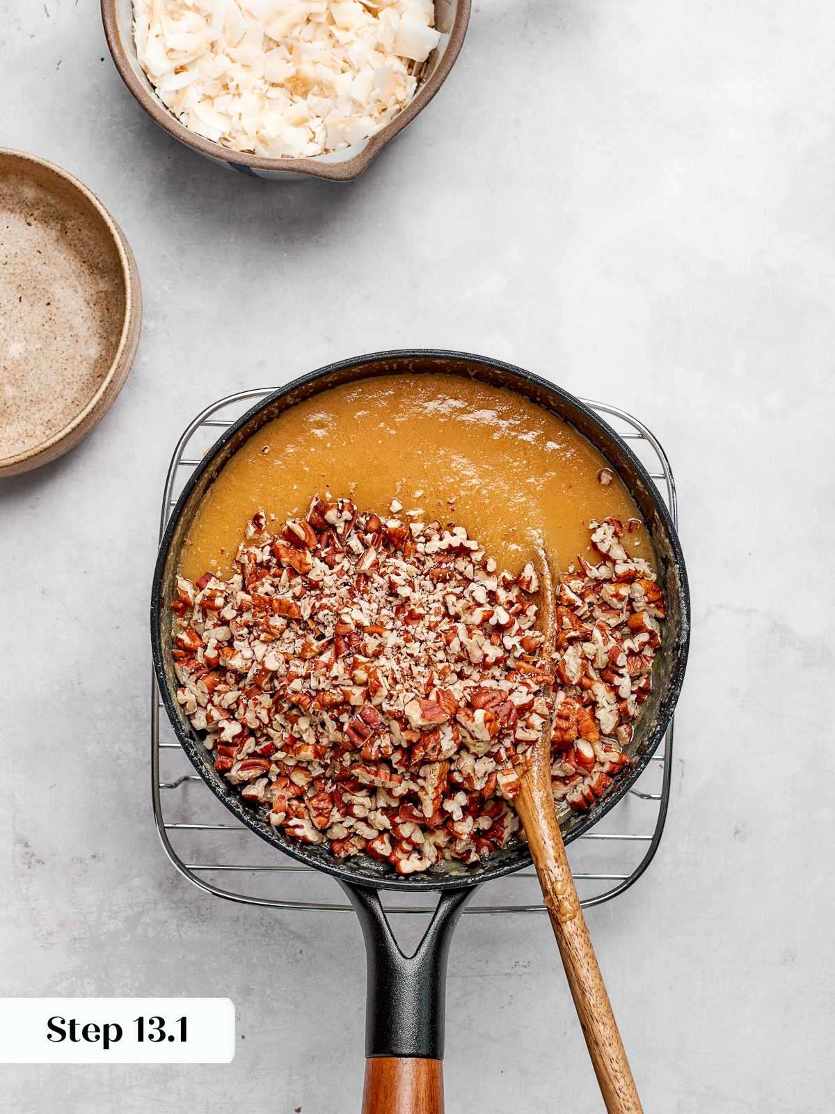 Toasted pecans folded into caramelized coconut frosting mixture.