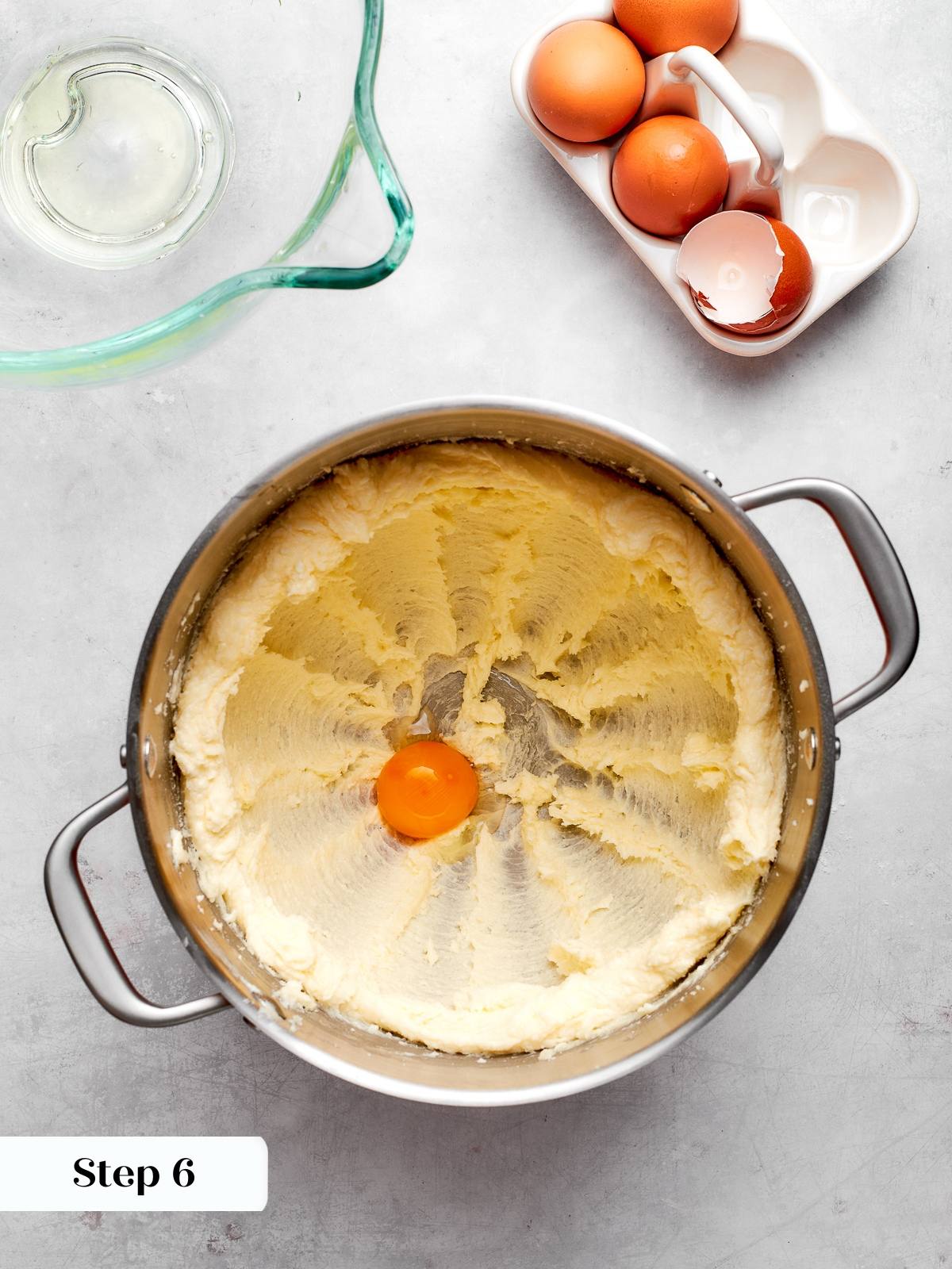 Egg yolk added to creamed butter and sugar mixture for cake batter.