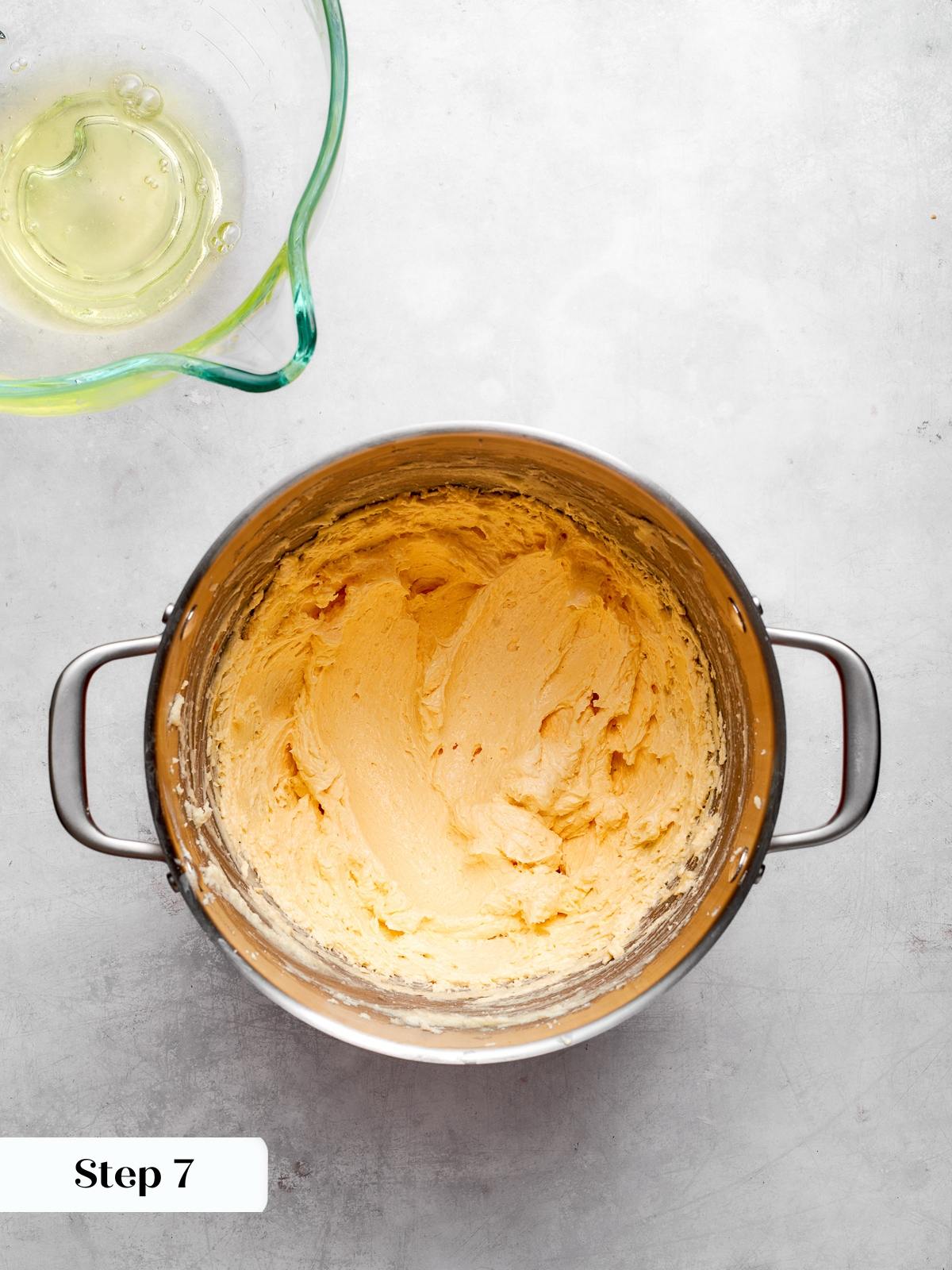 Pale cake batter prepared before melted chocolate is added to mixture.