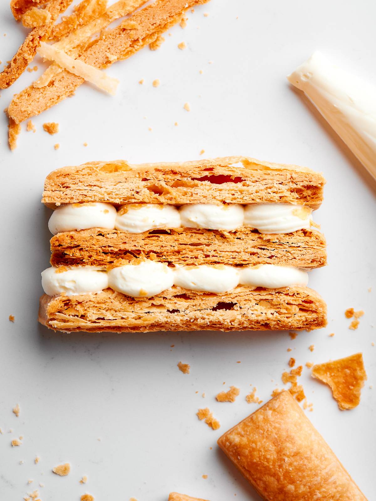 Cross-section of pastry revealing even layers and light, delicate crumb.