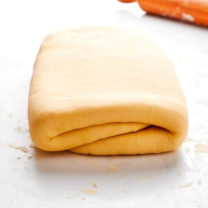 Dough resting on lightly floured surface to prevent sticking during rolling.