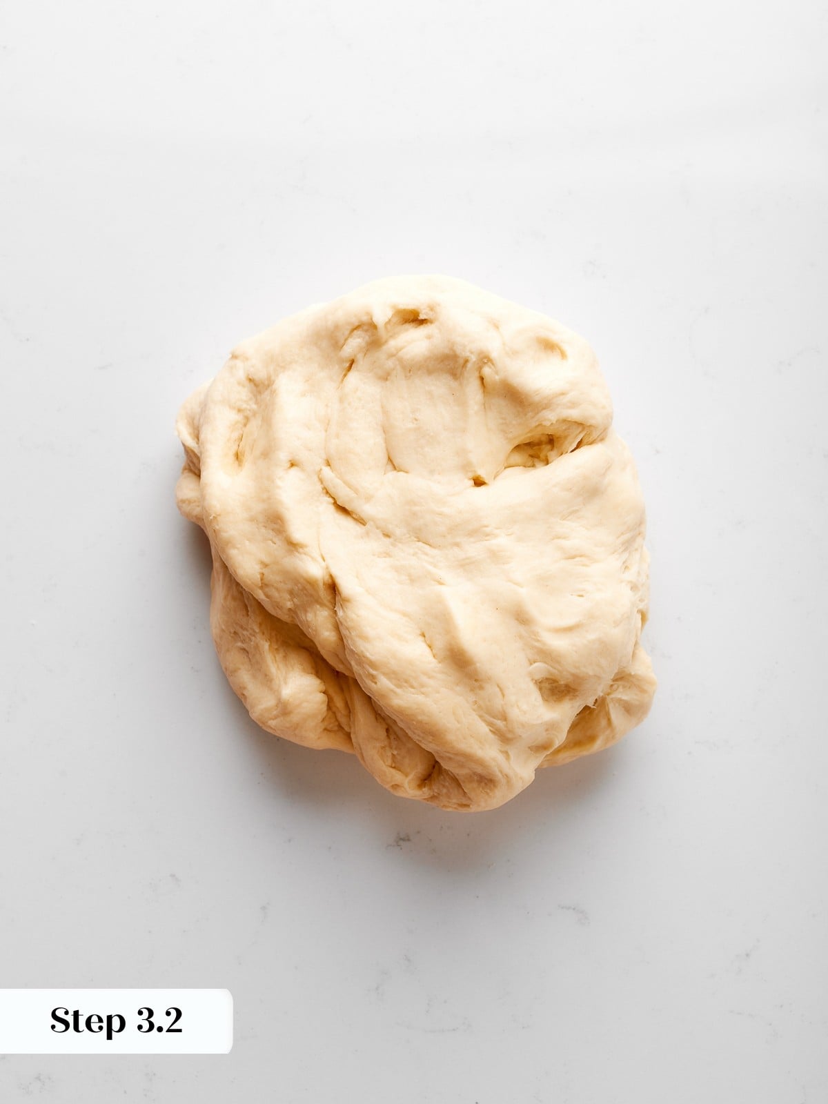 Dough gently kneaded until smooth, developing structure without overworking gluten.