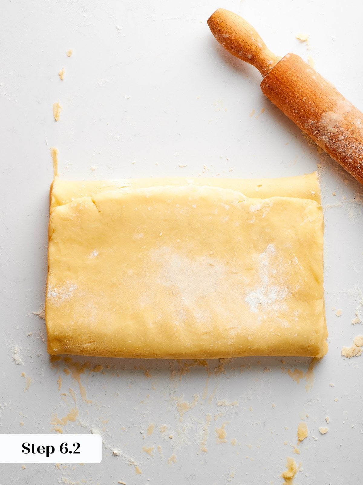 First envelope fold performed, dough folded into thirds to begin lamination process.