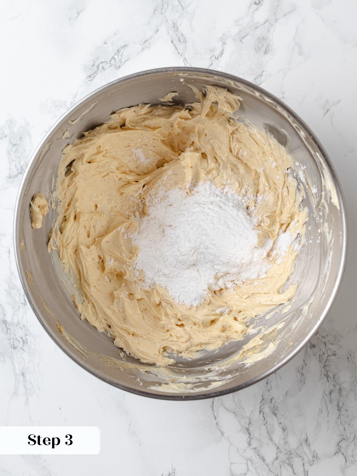 Powdered sugar added gradually to butter mixture while making peanut butter buttercream.