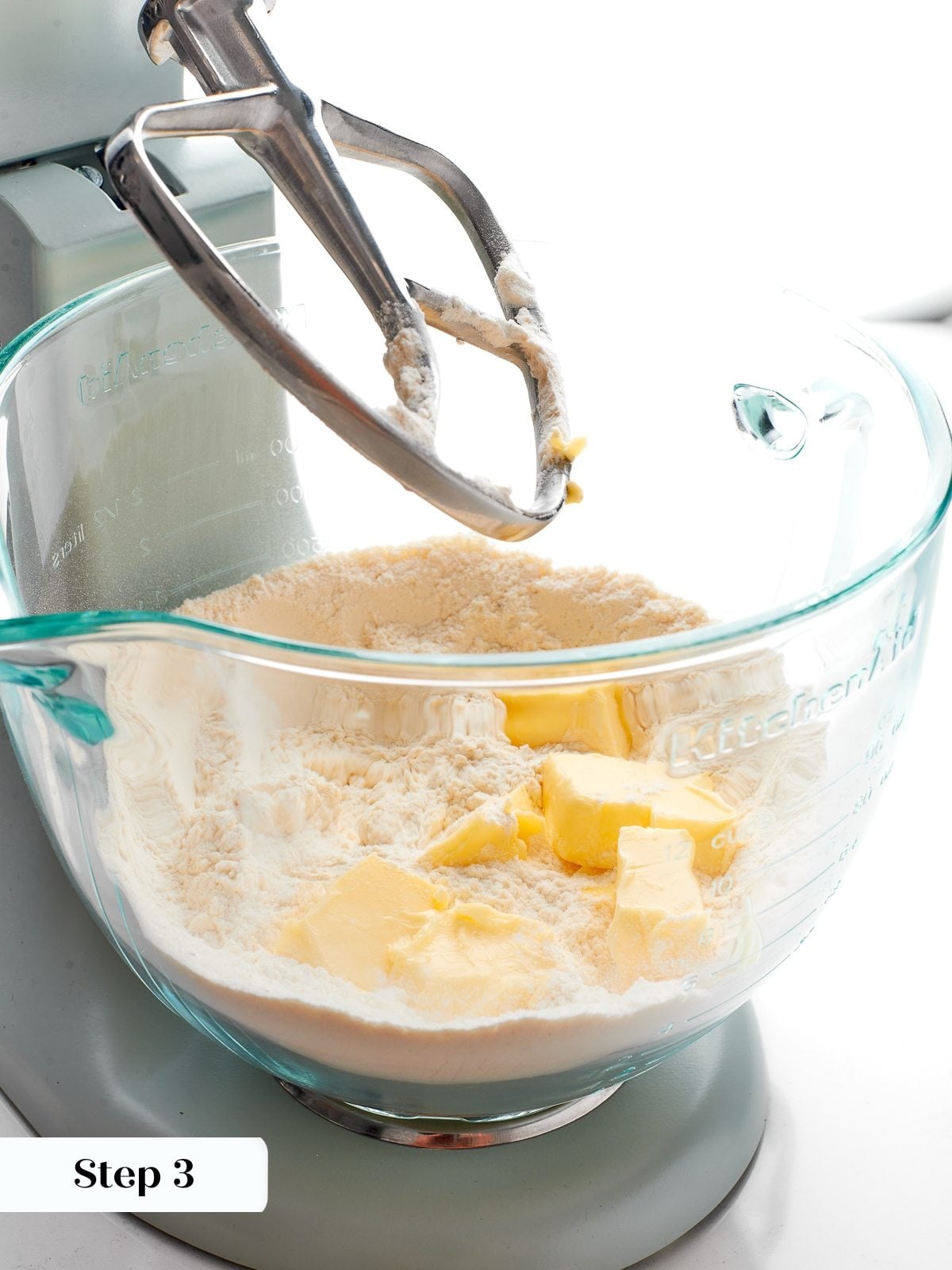 Softened butter cut into flour mixture until evenly distributed with no visible chunks.