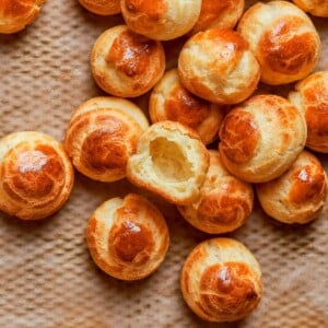 Baked choux pastry with deep golden color indicating crisp exterior and proper oven drying.