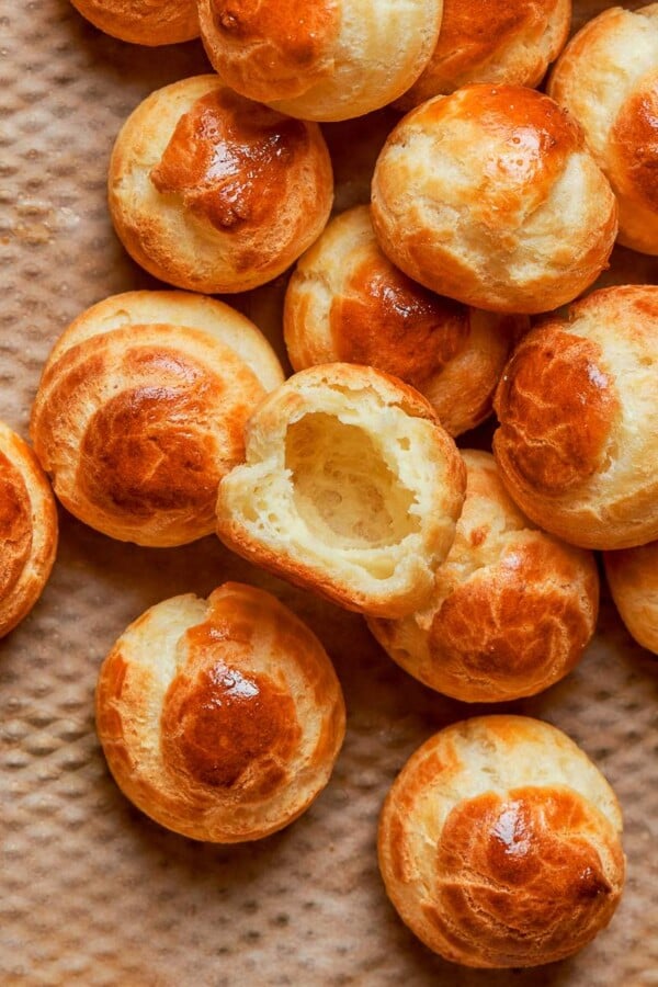 Baked choux pastry with deep golden color indicating crisp exterior and proper oven drying.