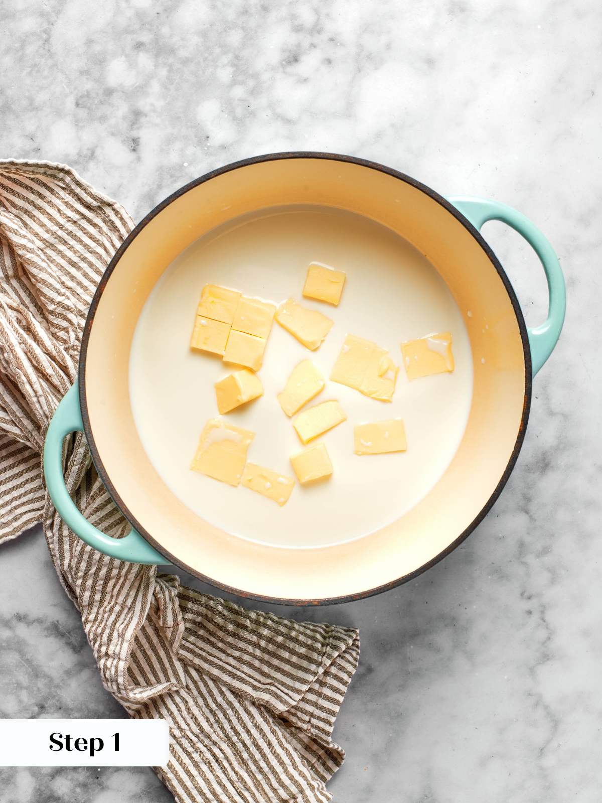 cubed butter and milk in pot for choux paste.