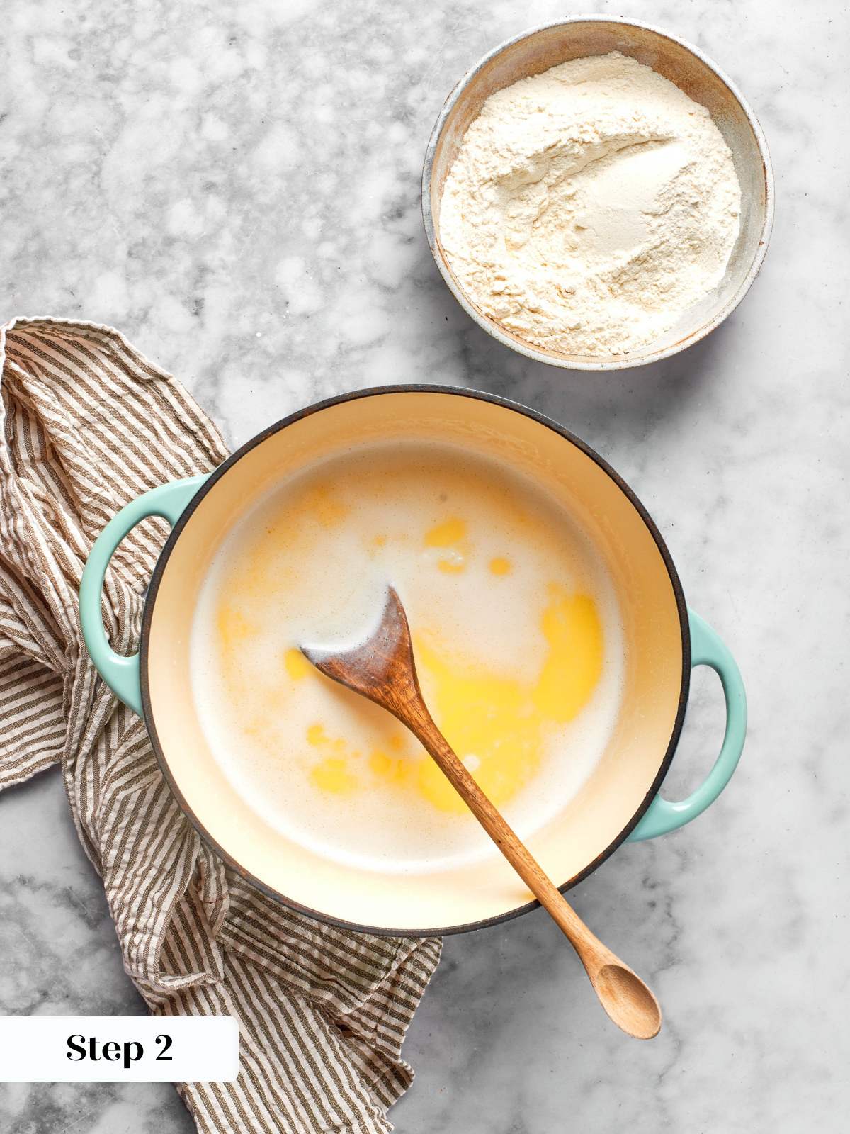 melted butter and milk in pot for choux paste.