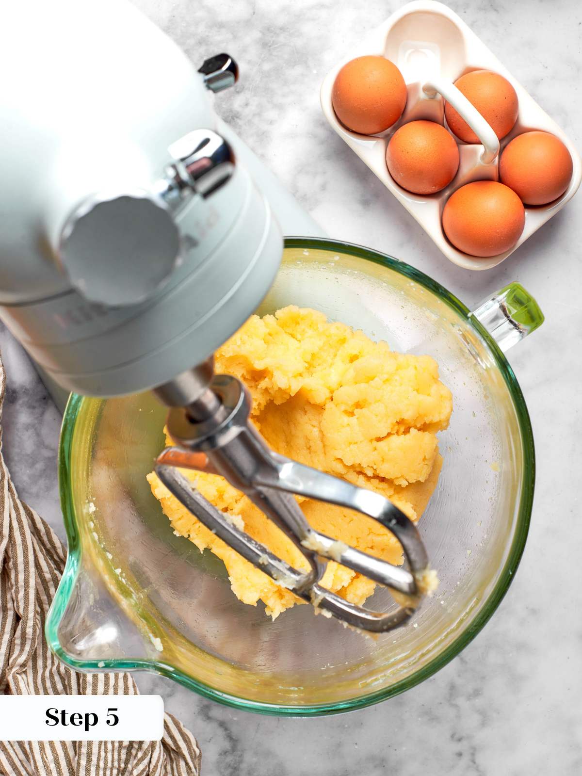 releasing steam from choux panade in mixer.