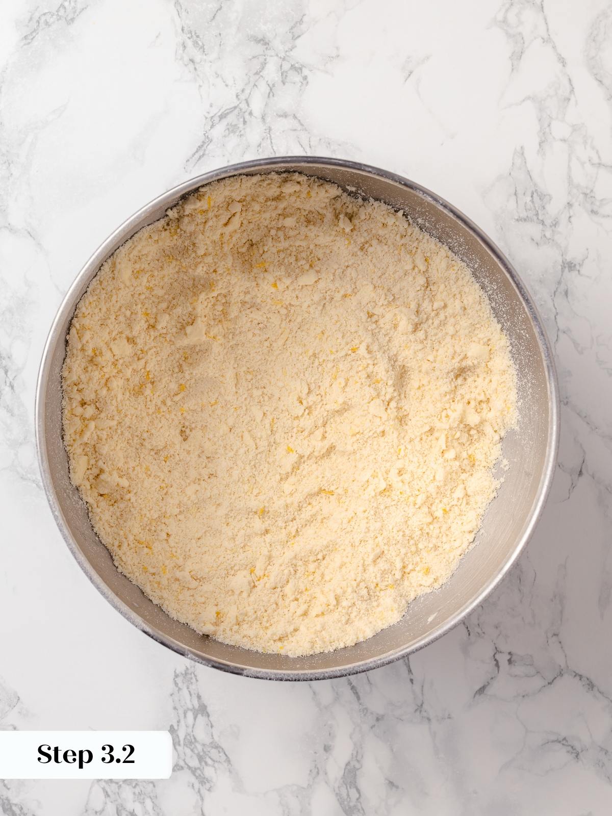 Flour and butter mixture resembling wet sand after properly cutting butter into dry ingredients.