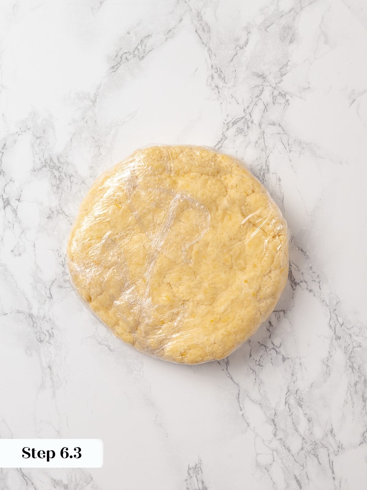 Chilled scone dough resting after refrigeration, ready for rolling and shaping into triangles.