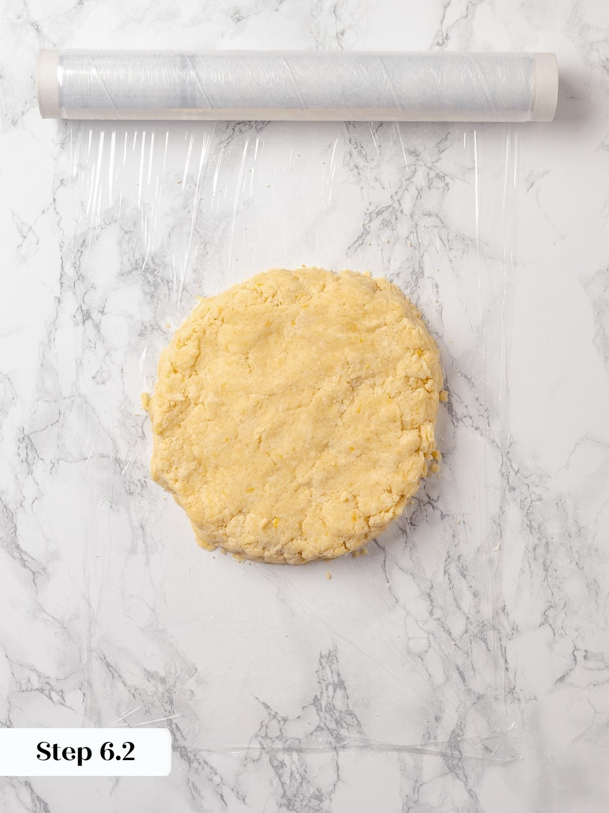 Scone dough pressed into flat disk before chilling to develop structure and flavor.