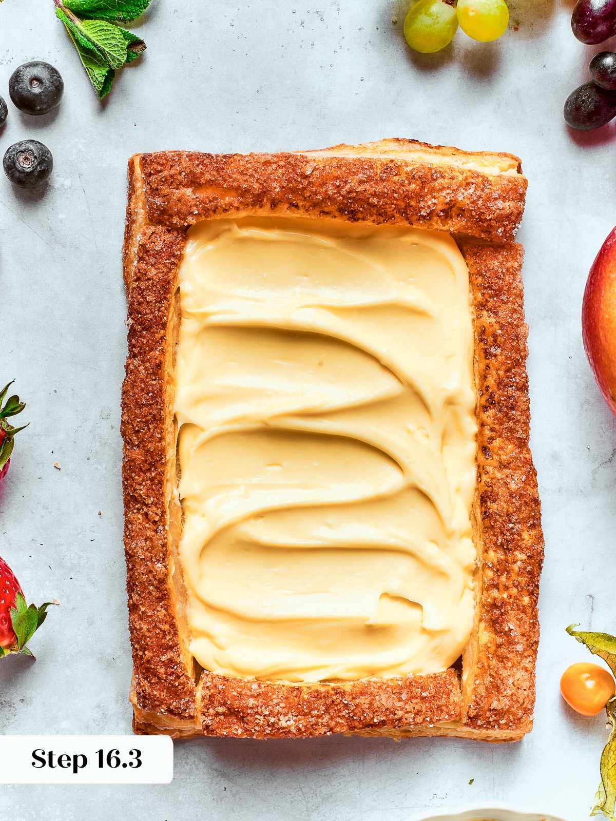 Tart shell filled with smooth layer of pastry cream spread just below edges.