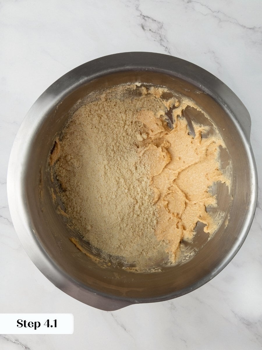 Adding the dry mix gradually keeps the almond flour chocolate chip cookies dough from turning greasy.