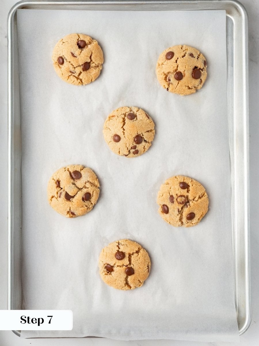 Crackled tops and matte centers tell you the almond flour chocolate chip cookies are perfectly baked.