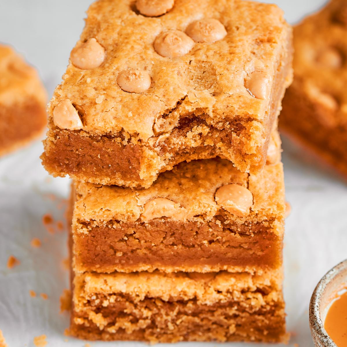 Framed square for the recipe card, these peanut butter blondies show off their signature chew.
