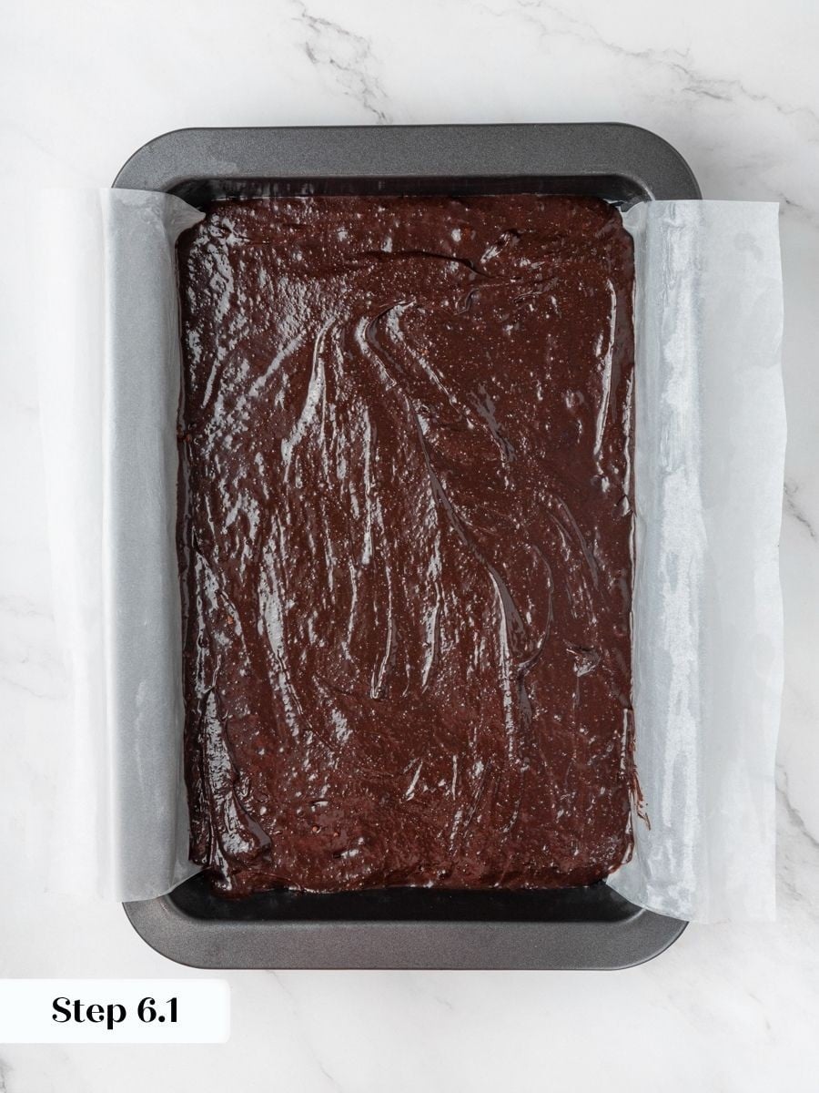 An even layer gives the peanut butter brownies a flat base so the swirl reads clearly.
