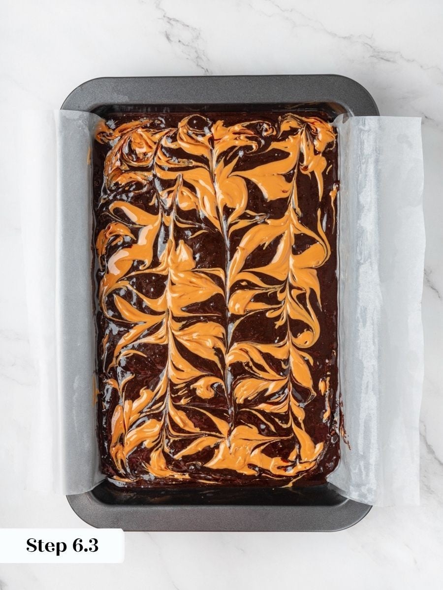 The swirl shows distinct ribbons that keep peanut butter visible in every baked peanut butter brownie.
