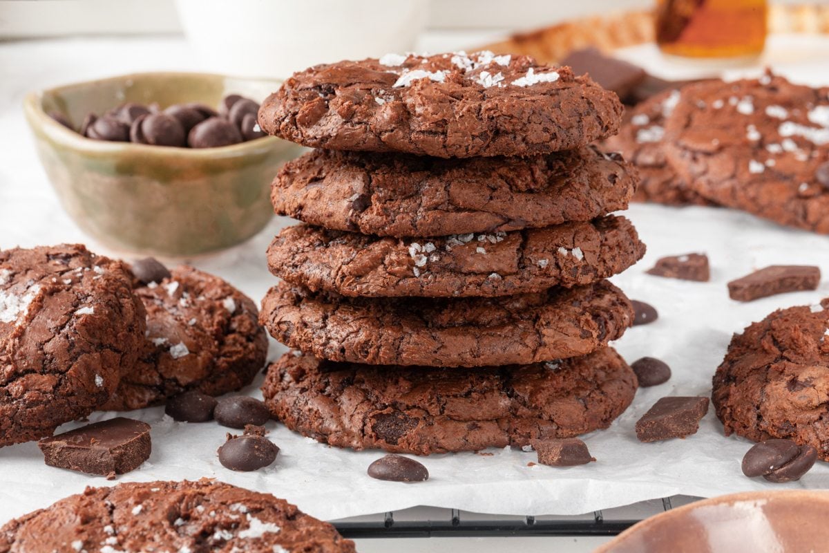 This landscape shot lines up several brownie cookies to showcase their fissured, salted tops.