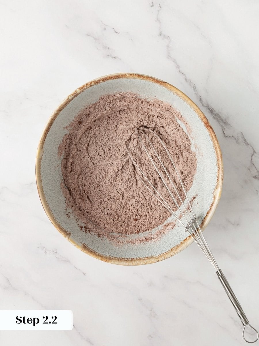 Whisking the dry blend evenly prevents streaks so brownie cookies bake with consistent chocolate color.